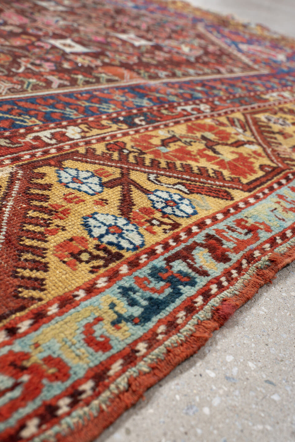 4' x 5' one-of-a-kind handmade vintage Anatolian small size rug. Color palette: rust, indigo, ivory, burgundy, sky blue