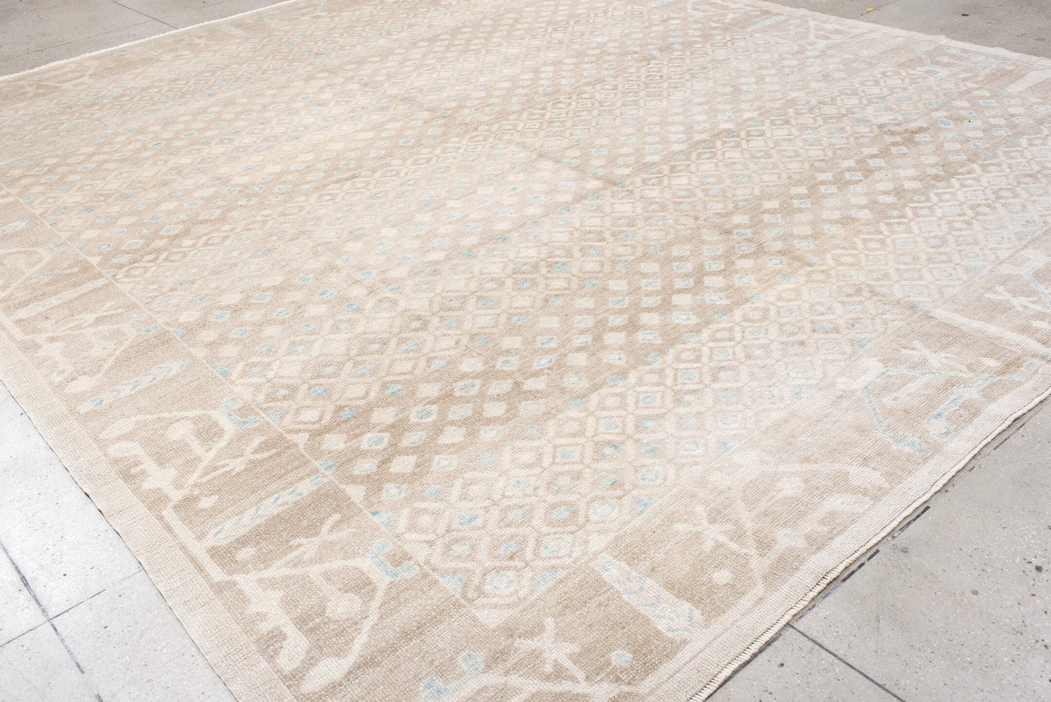 12' x 14' one-of-a-kind handmade vintage Trs oversize rug. Color palette: beige, ivory, taupe, pale blue, cream, gray
