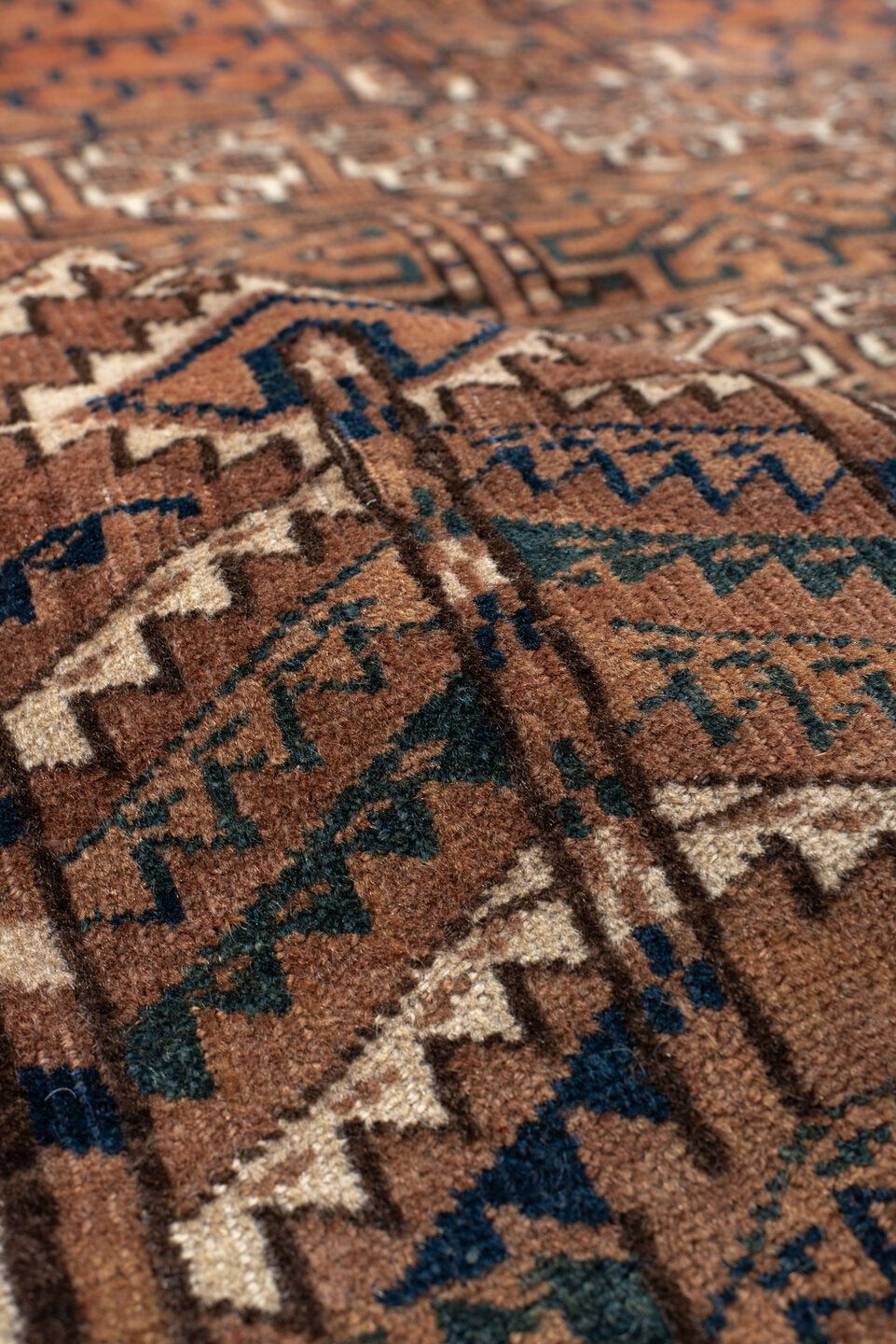 3' x 4' one-of-a-kind handmade vintage Torkaman small size rug. Color palette: rust, brown, ivory, charcoal, camel, navy