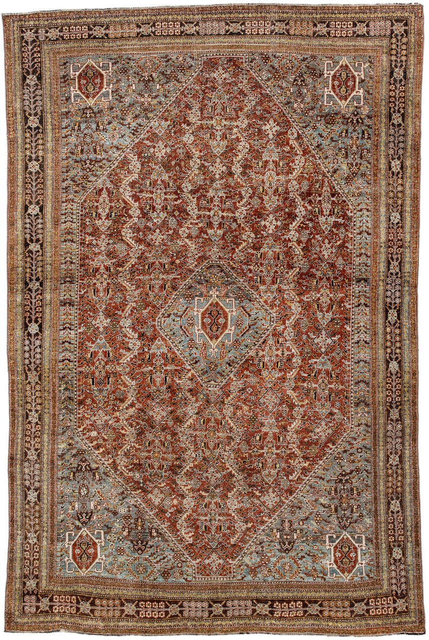 6' x 9' one-of-a-kind handmade vintage Qashqai medium size rug. Color palette: rust, light blue, ivory, brown, charcoal