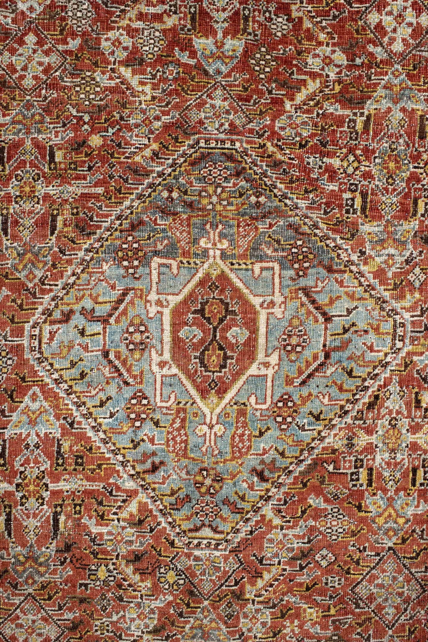 6' x 9' one-of-a-kind handmade vintage Qashqai medium size rug. Color palette: rust, light blue, ivory, brown, charcoal
