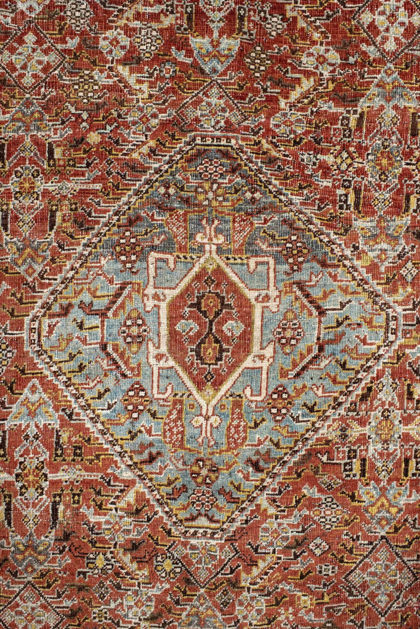 6' x 9' one-of-a-kind handmade vintage Qashqai medium size rug. Color palette: rust, light blue, ivory, brown, charcoal