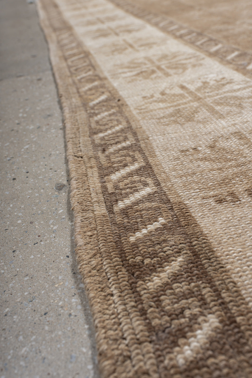 6' x 9' one-of-a-kind handmade vintage Kars medium size rug. Color palette: off-white, orange, brown, light gray, gray, pink