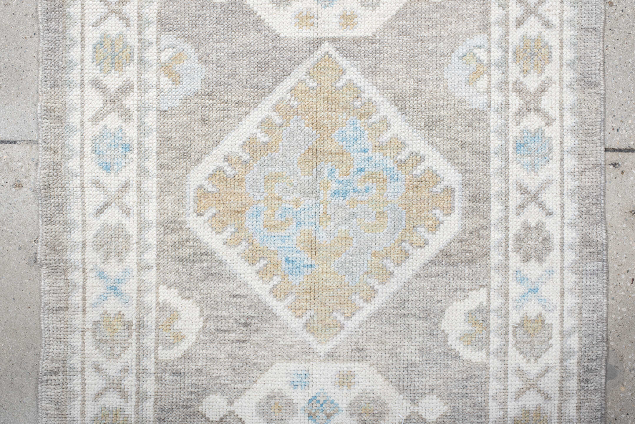 3' x 10' one-of-a-kind handmade vintage runner rug. Color palette: dark gray, gainsboro, gray, light blue, light gray