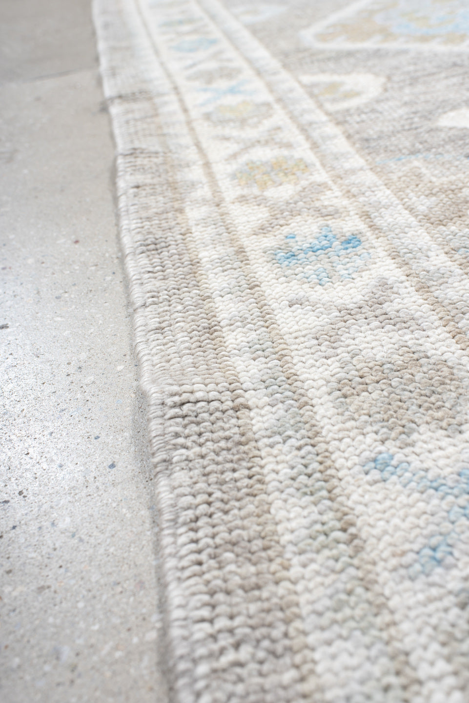 3' x 10' one-of-a-kind handmade vintage runner rug. Color palette: dark gray, gainsboro, gray, light blue, light gray