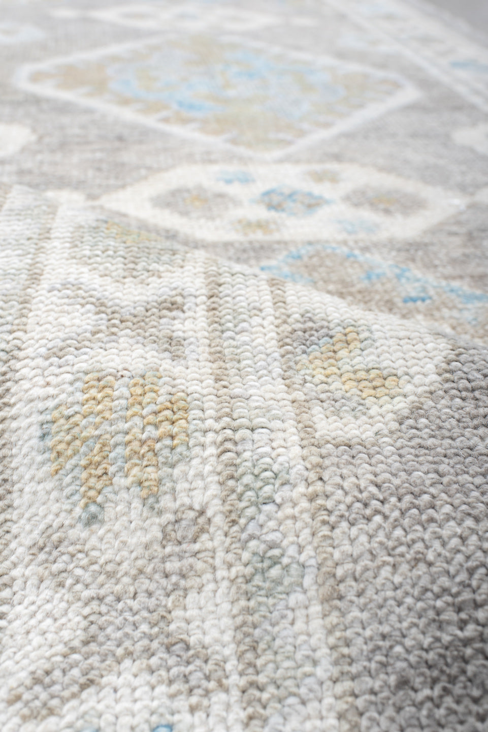 3' x 10' one-of-a-kind handmade vintage runner rug. Color palette: dark gray, gainsboro, gray, light blue, light gray