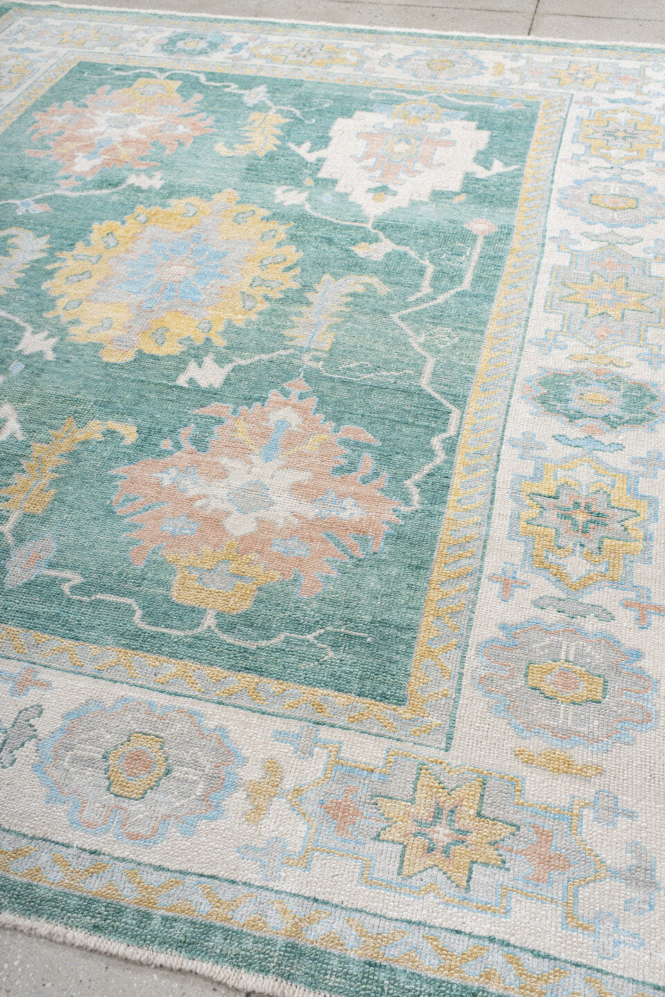 8' x 9' one-of-a-kind handmade vintage Oushak rug. Color palette: seafoam, ivory, pale gold, blush, powder blue, sage, teal
