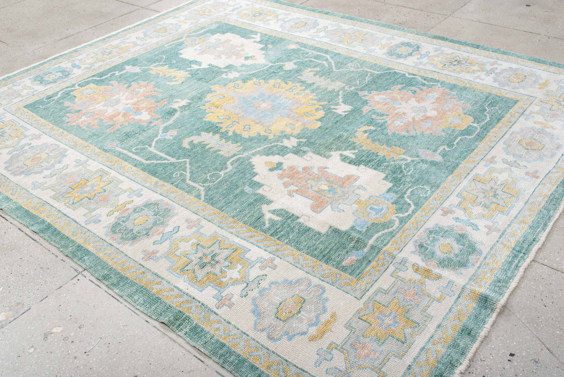 8' x 9' one-of-a-kind handmade vintage Oushak rug. Color palette: seafoam, ivory, pale gold, blush, powder blue, sage, teal