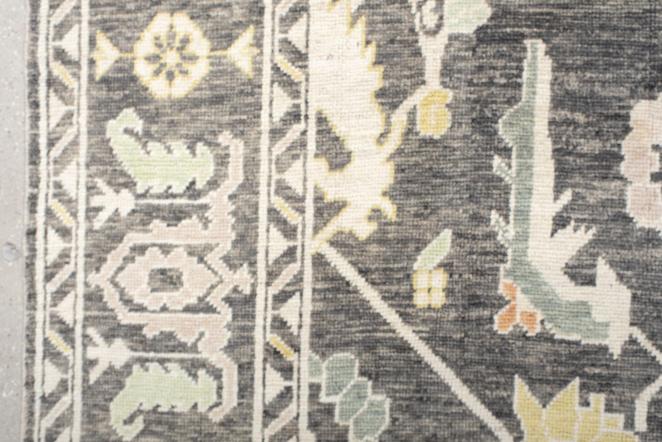 9' x 15' one-of-a-kind handmade vintage Oushak rug. Color palette: charcoal, ivory, sage, gold, peach, taupe, gray, black