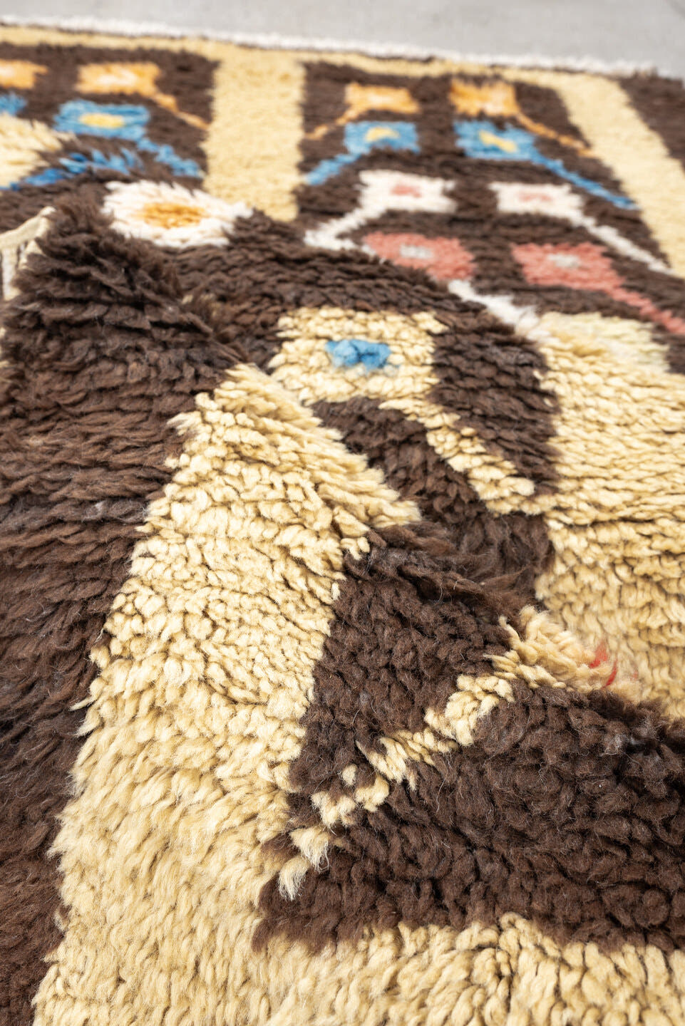 3' x 6' one-of-a-kind handmade vintage Tulu rug. Color palette: brown, ivory, sky_blue, coral, saffron, cream, light blue