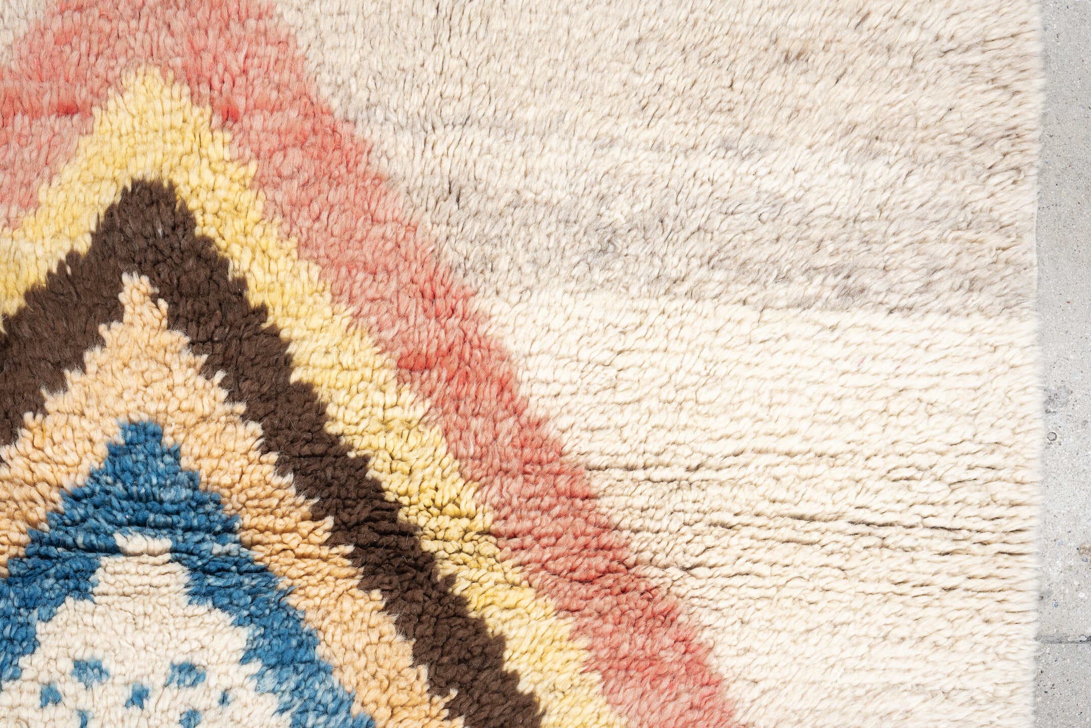 4' x 6' one-of-a-kind handmade vintage Moroccan small size rug. Color palette: ivory, rose, brown, blue, gold, peach, taupe