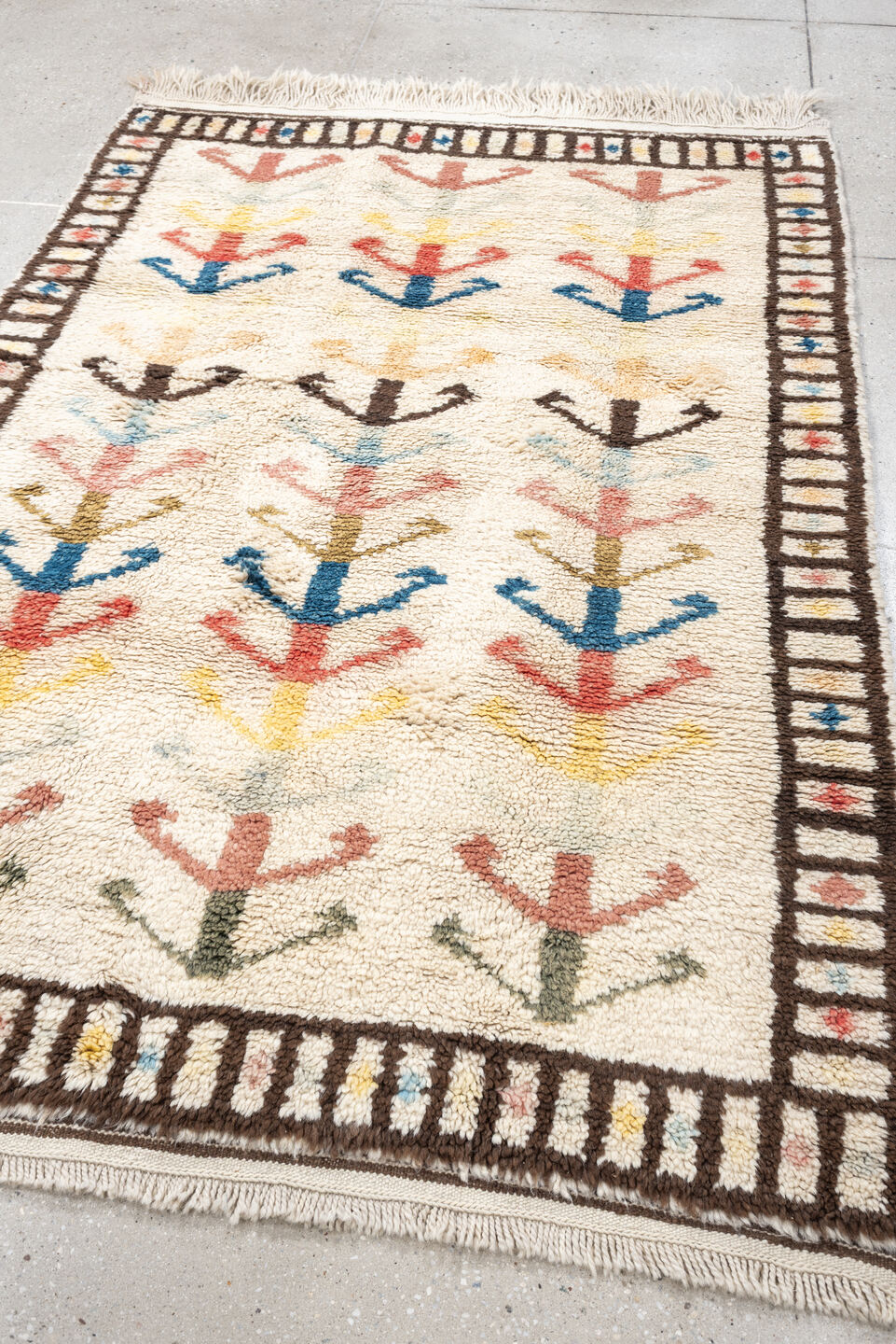 4' x 6' one-of-a-kind handmade vintage Moroccan small size rug. Color palette: ivory, brown, blue, coral, yellow, olive