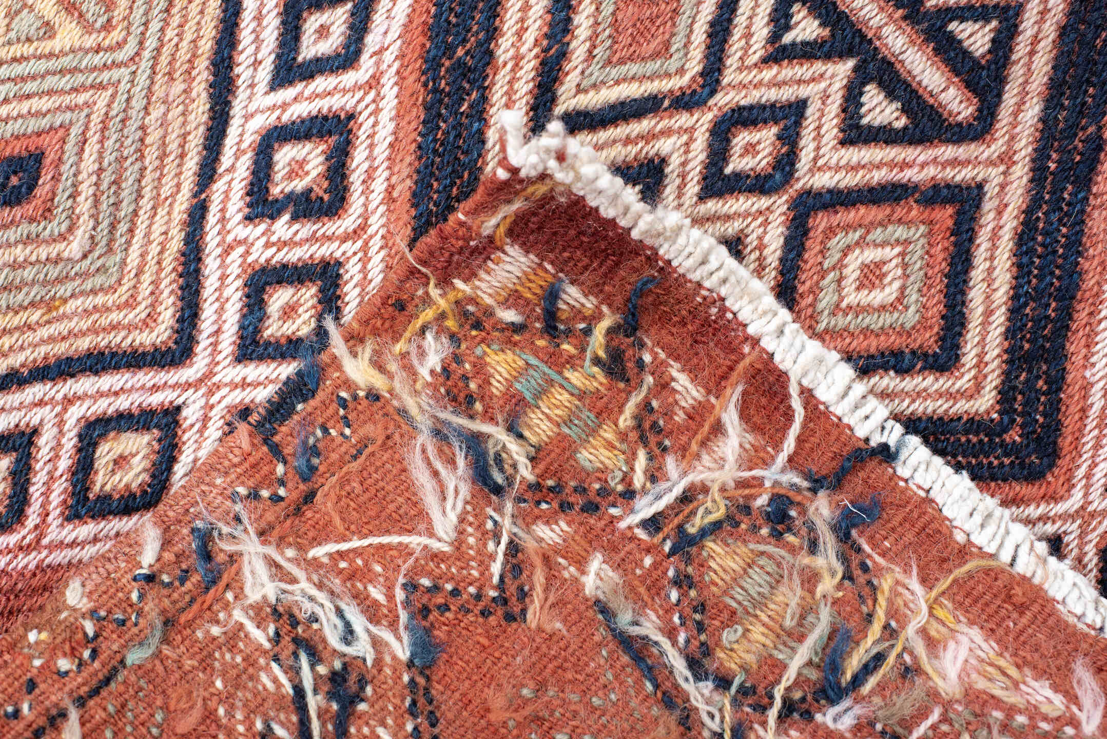 2' x 12' one-of-a-kind handmade vintage Jijim runner rug. Color palette: brown, gray, off-white, orange, pink, red, redwood