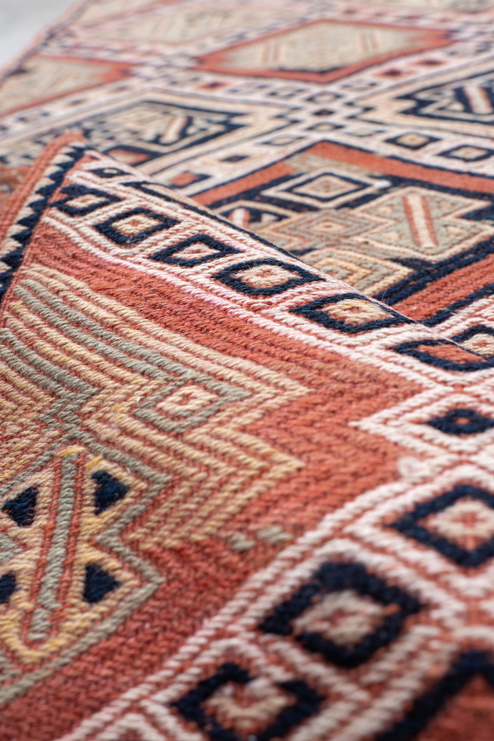 2' x 12' one-of-a-kind handmade vintage Jijim runner rug. Color palette: ivory, terra cotta, charcoal, rust, camel