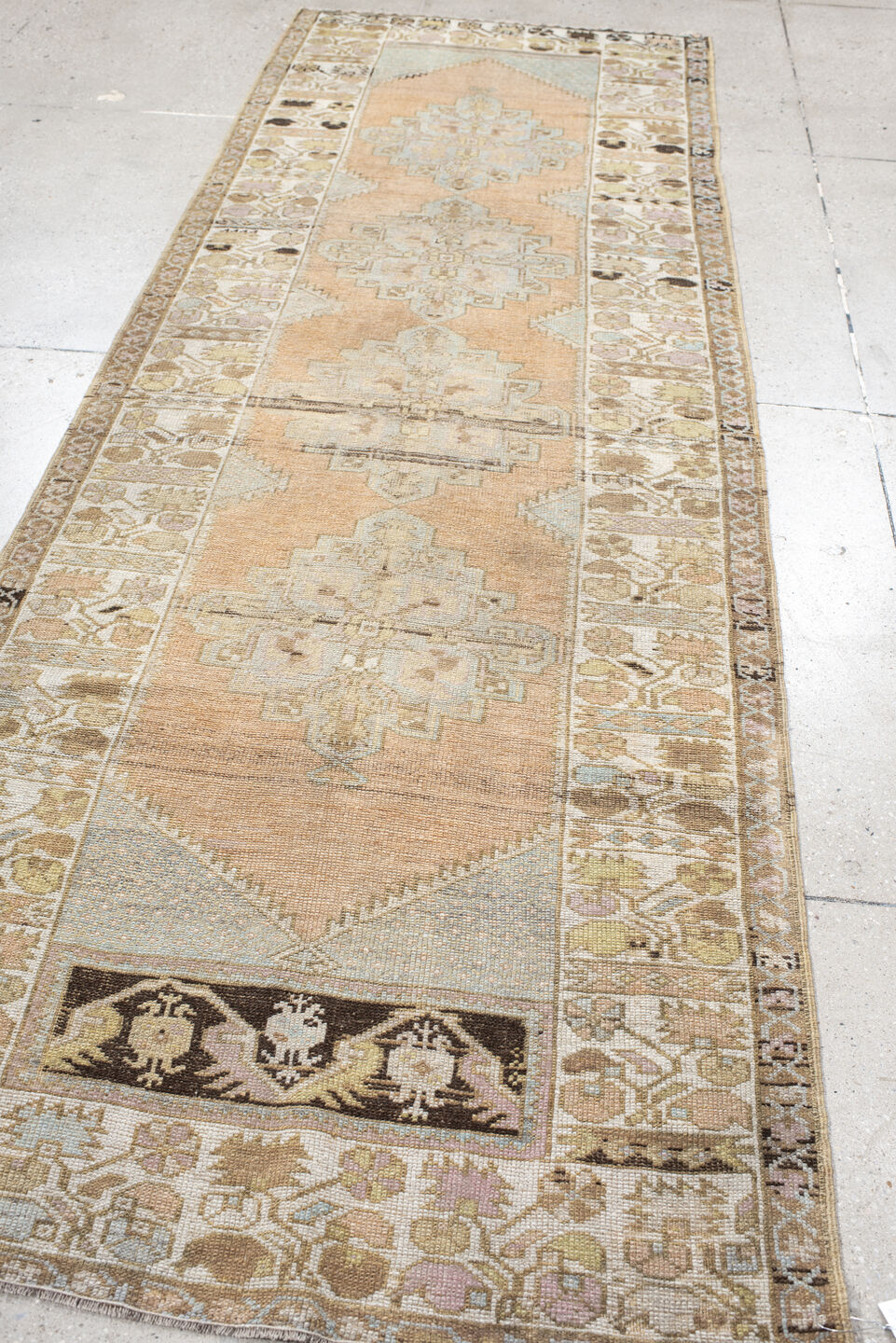 3' x 10' one-of-a-kind handmade vintage Oushak runner rug. Color palette: peach, ivory, taupe, sage, camel, charcoal, cream