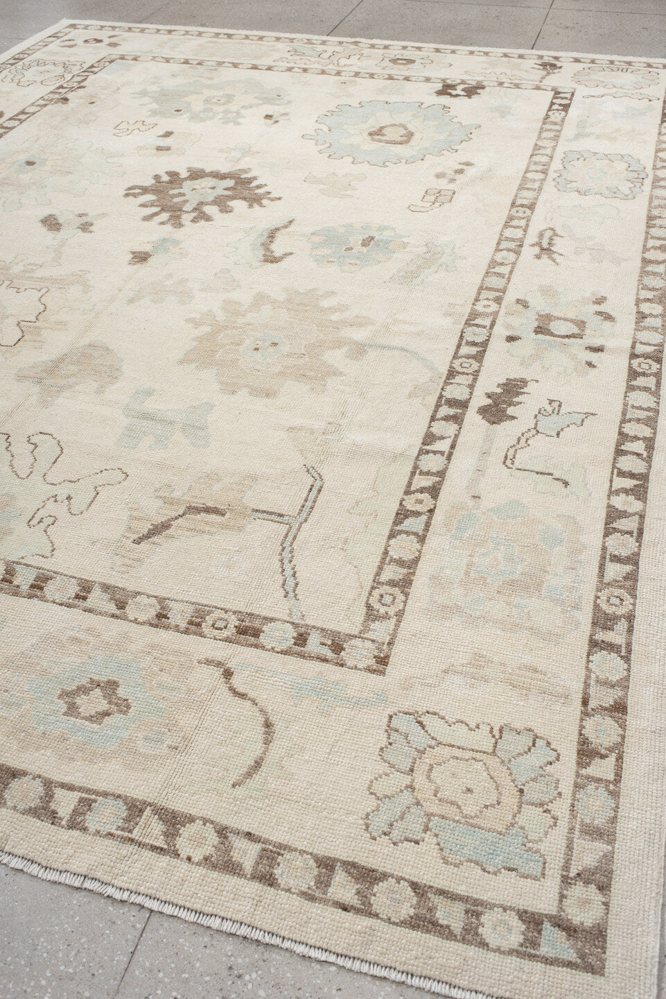 9' x 12' one-of-a-kind handmade vintage Oushak large size rug. Color palette: ivory, cream, taupe, sky_blue, brown, beige