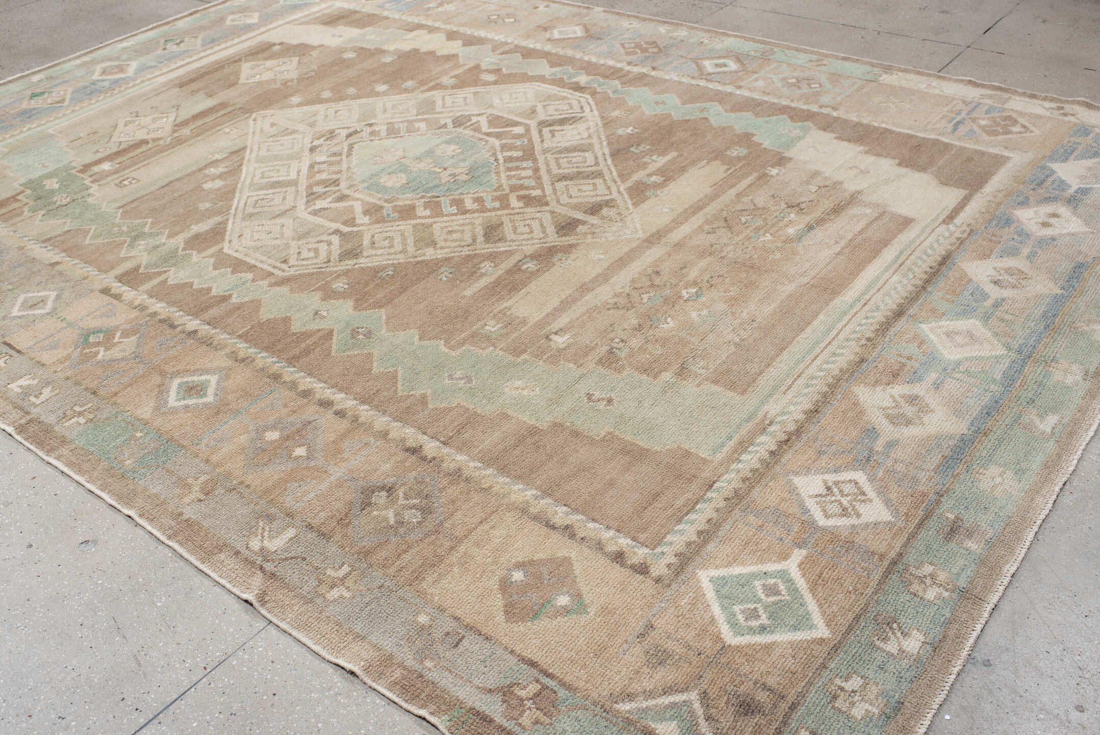 9' x 12' one-of-a-kind handmade vintage Oushak large size rug. Color palette: taupe, ivory, aqua, beige, sand, pale blue