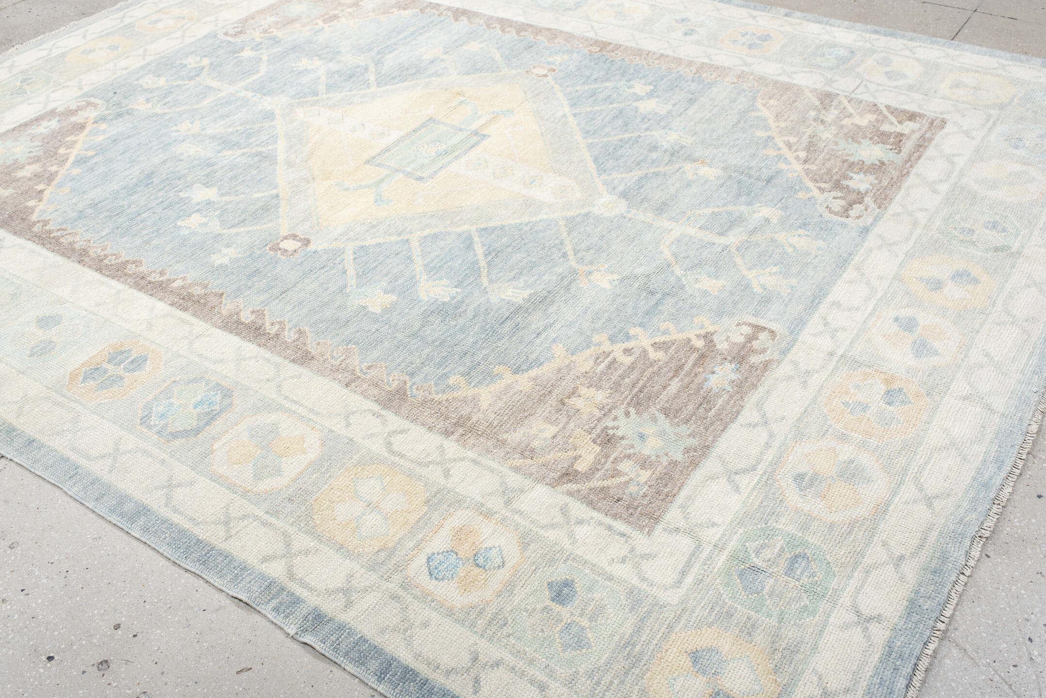 8' x 10' one-of-a-kind handmade vintage Oushak large size rug. Color palette: pale blue, ivory, cream, taupe, beige