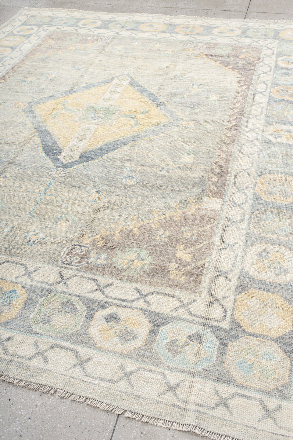8' x 10' one-of-a-kind handmade vintage Oushak large size rug. Color palette: ivory, pale blue, taupe, sage, cream, beige