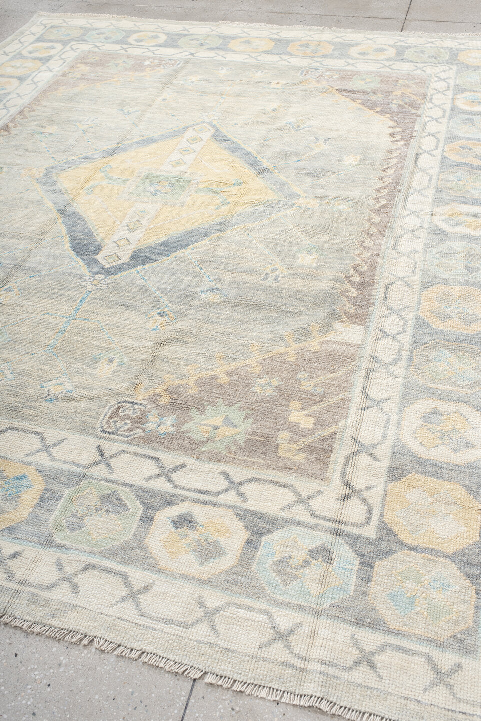 8' x 10' one-of-a-kind handmade vintage Oushak large size rug. Color palette: ivory, pale blue, taupe, sage, cream, beige
