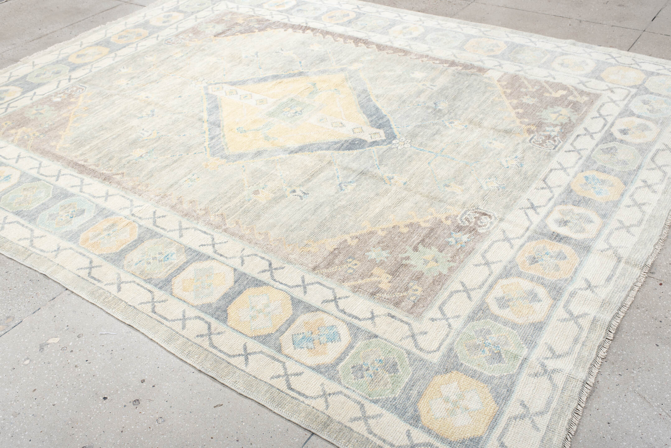 8' x 10' one-of-a-kind handmade vintage Oushak large size rug. Color palette: ivory, pale blue, taupe, sage, cream, beige