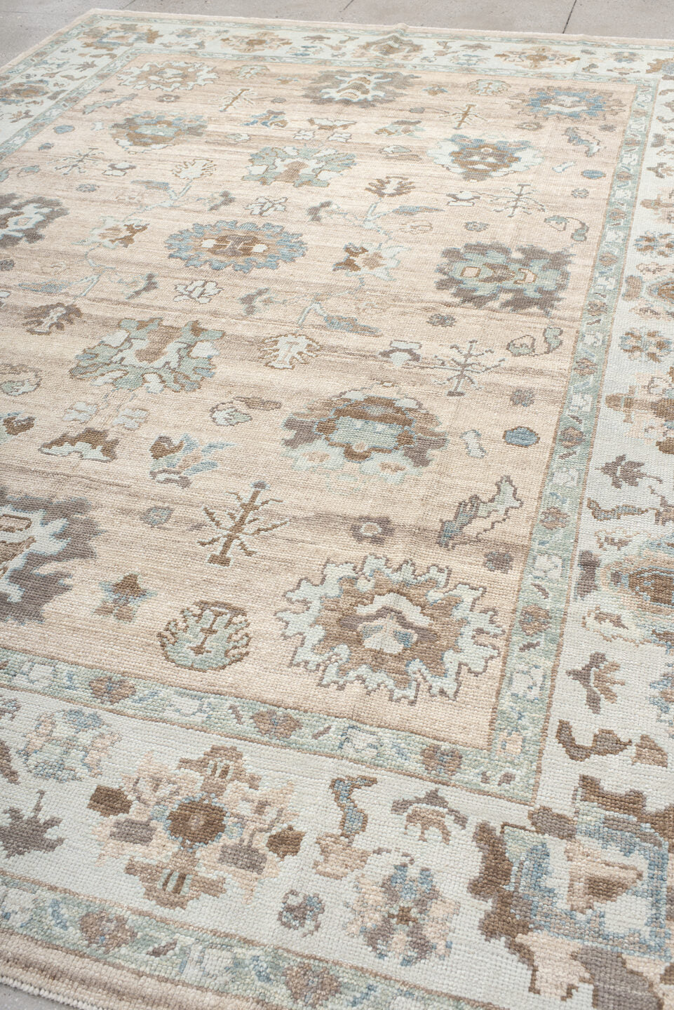 9' x 12' one-of-a-kind handmade vintage Oushak large size rug. Color palette: beige, ivory, light blue, taupe, brown, cream
