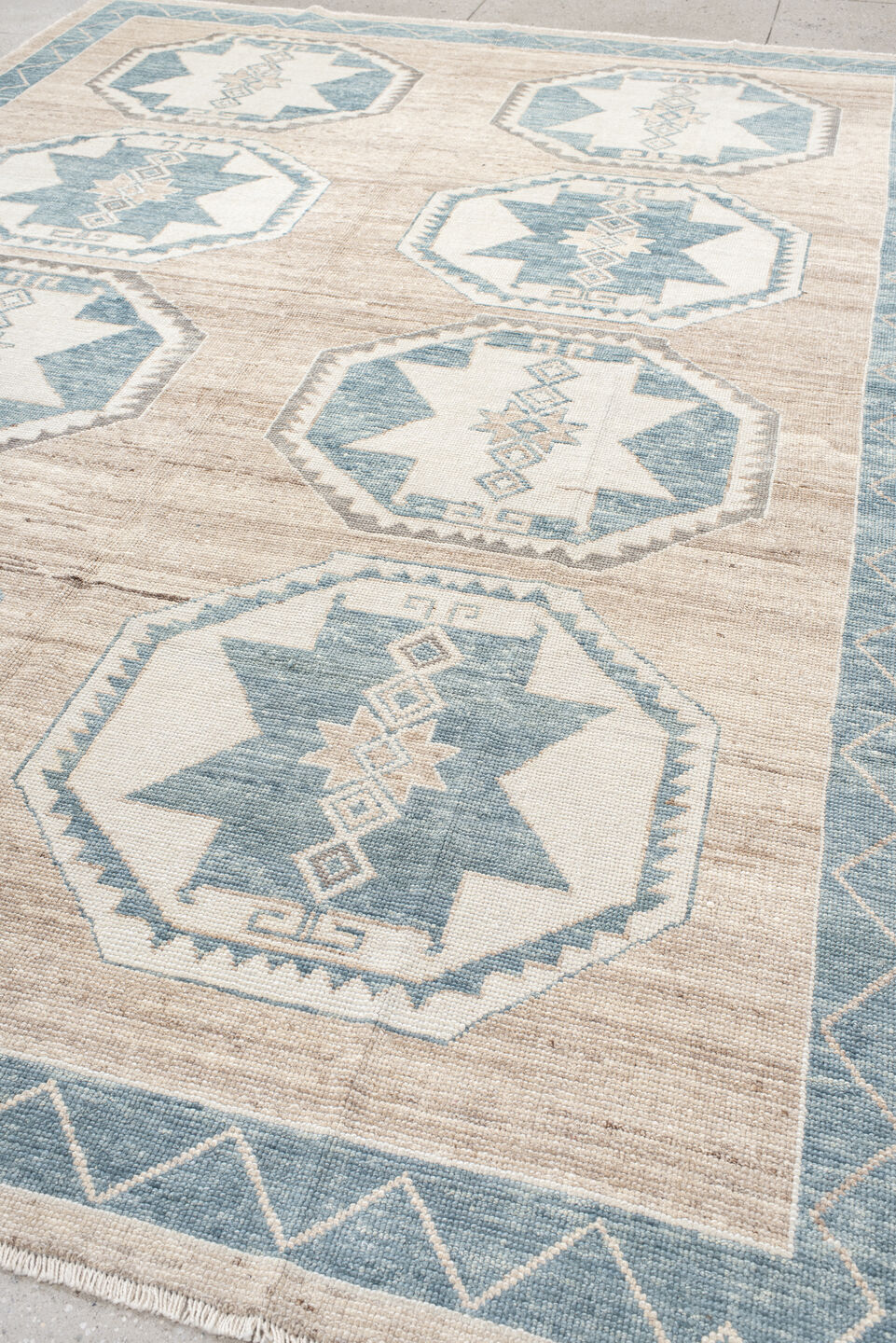 9' x 12' one-of-a-kind handmade vintage Oushak large size rug. Color palette: ivory, pale blue, taupe, beige, gray
