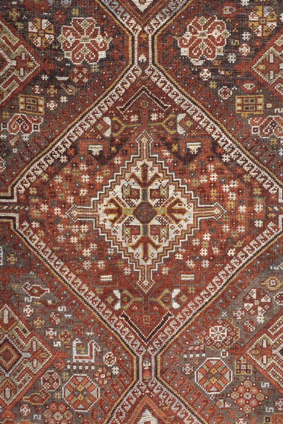 7' x 10' one-of-a-kind handmade antique Shiraz large size rug. Color palette: rust, ivory, brown, terra cotta, charcoal