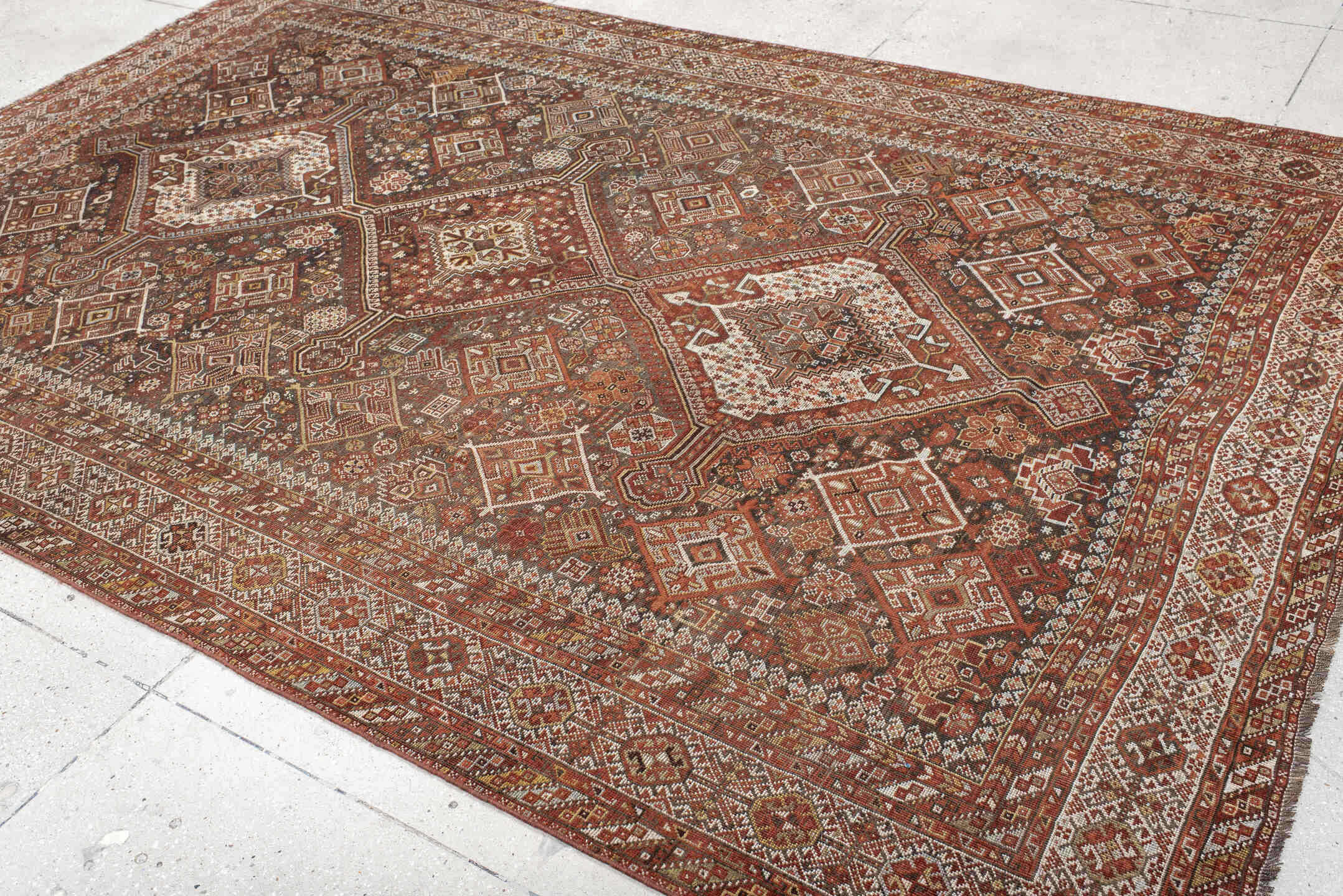 7' x 10' one-of-a-kind handmade antique Shiraz large size rug. Color palette: rust, ivory, brown, terra cotta, charcoal