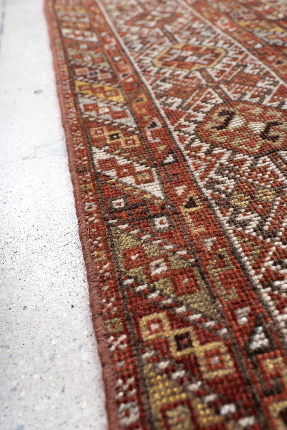 7' x 10' one-of-a-kind handmade antique Shiraz large size rug. Color palette: rust, ivory, brown, terra cotta, charcoal