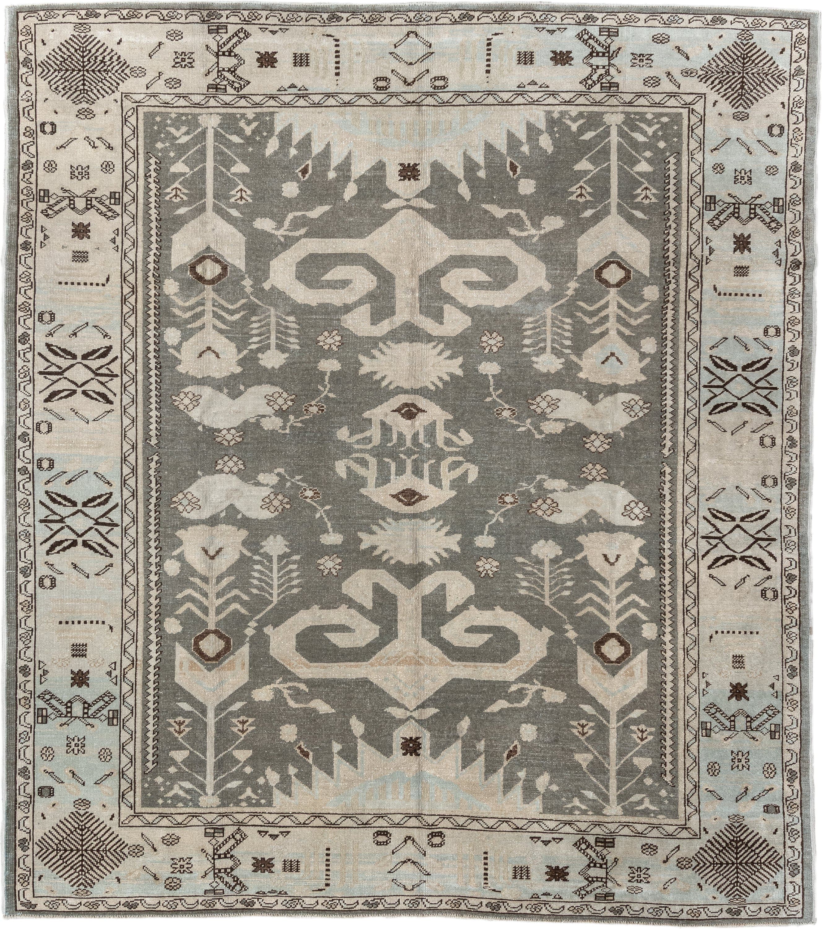 7' x 9' one-of-a-kind handmade vintage Anatolian rug. Color palette: charcoal, ivory, pale blue, taupe, brown, black, gray