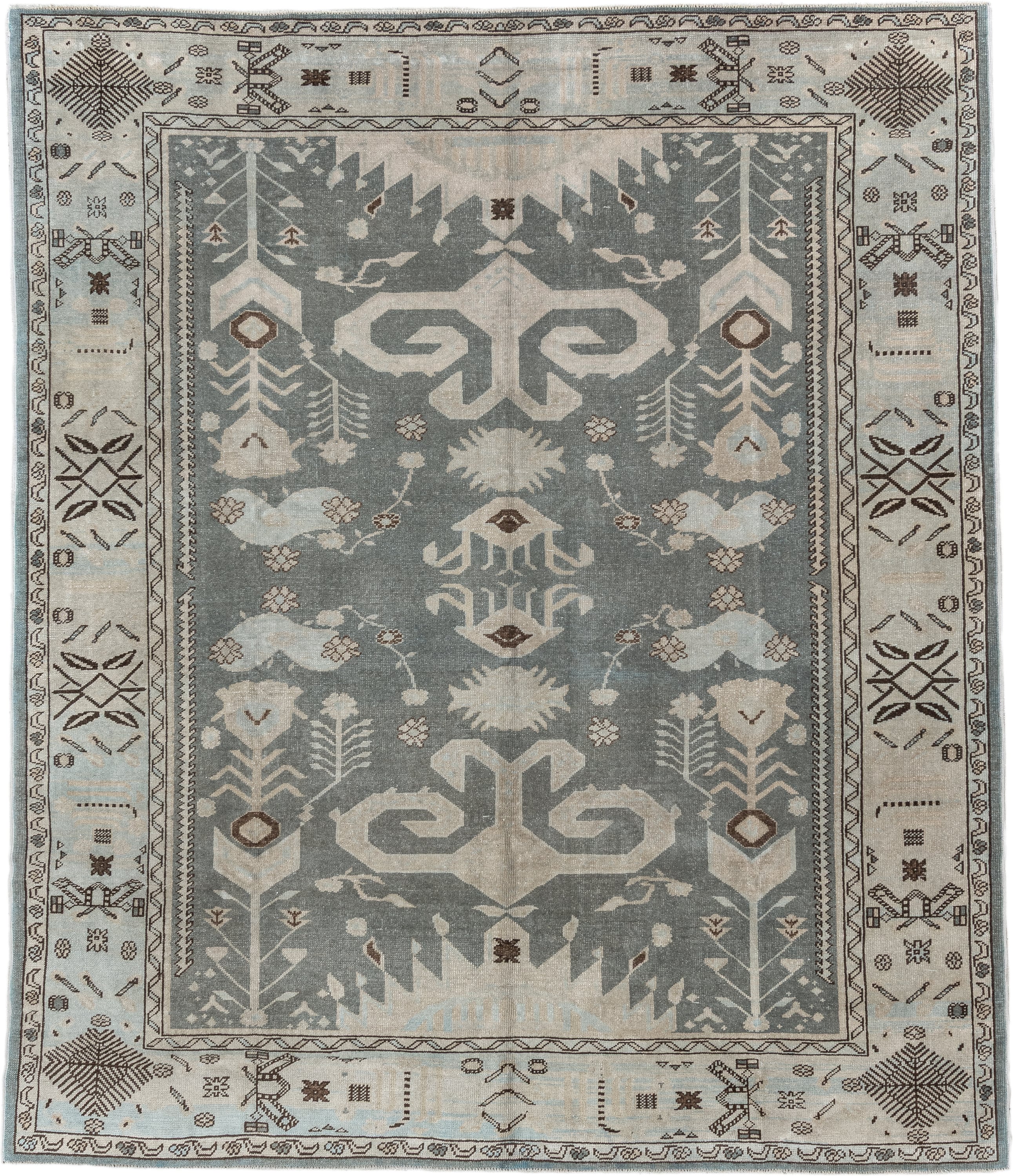 7' x 9' one-of-a-kind handmade vintage Anatolian rug. Color palette: ivory, slate, taupe, charcoal, brown, pale blue, gray