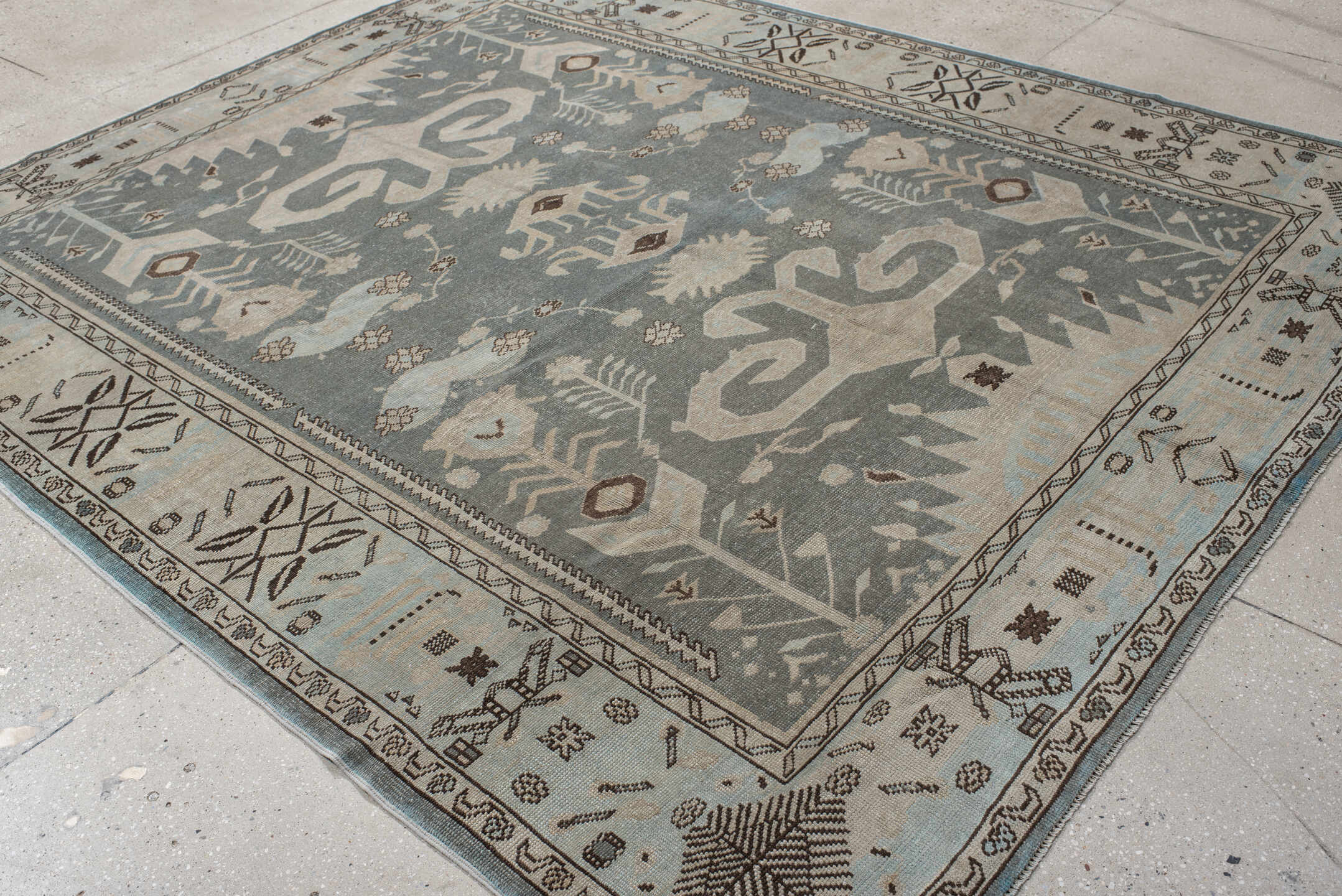 7' x 9' one-of-a-kind handmade vintage Anatolian rug. Color palette: ivory, slate, taupe, charcoal, brown, pale blue, gray