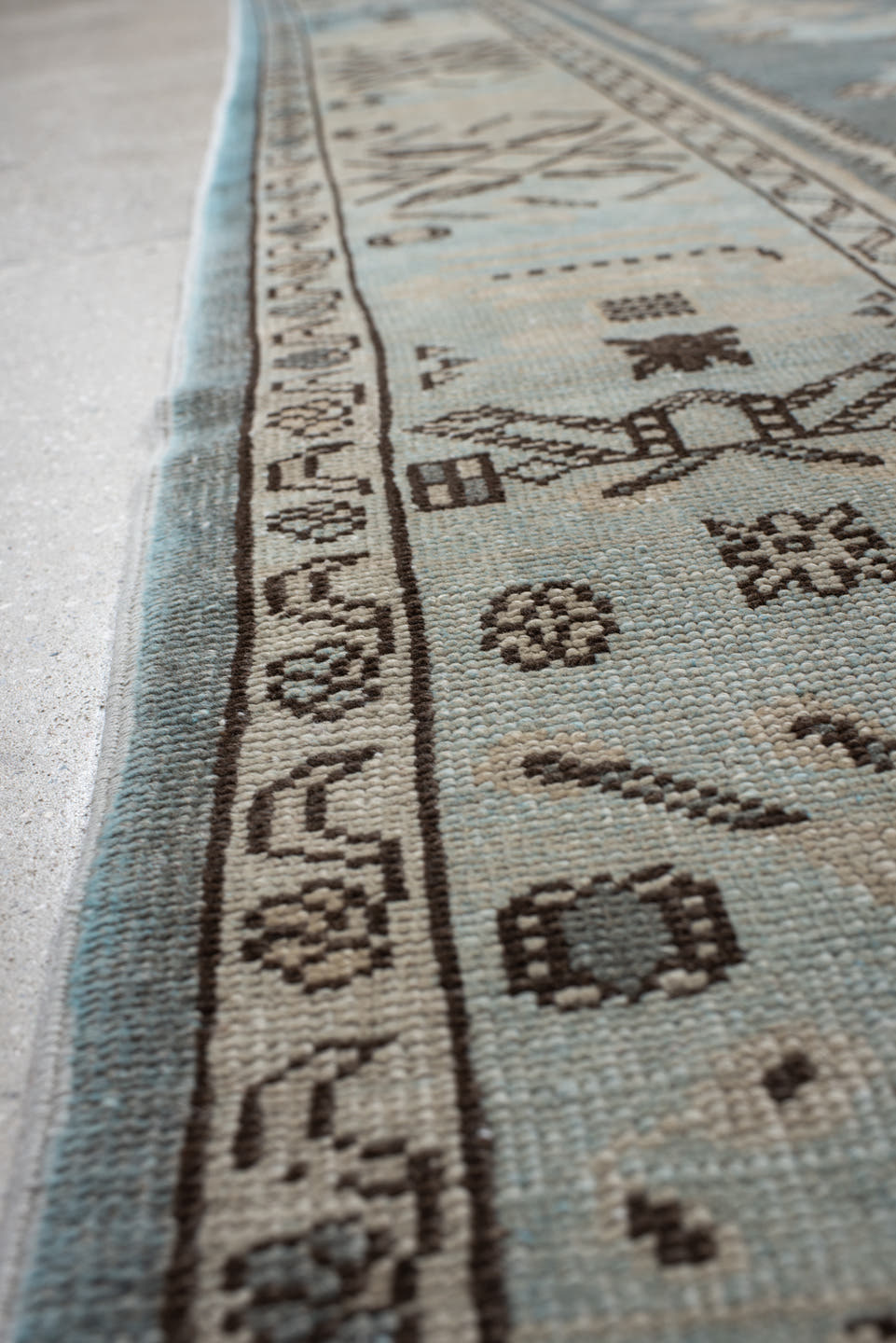 7' x 9' one-of-a-kind handmade vintage Anatolian rug. Color palette: ivory, slate, taupe, charcoal, brown, pale blue, gray