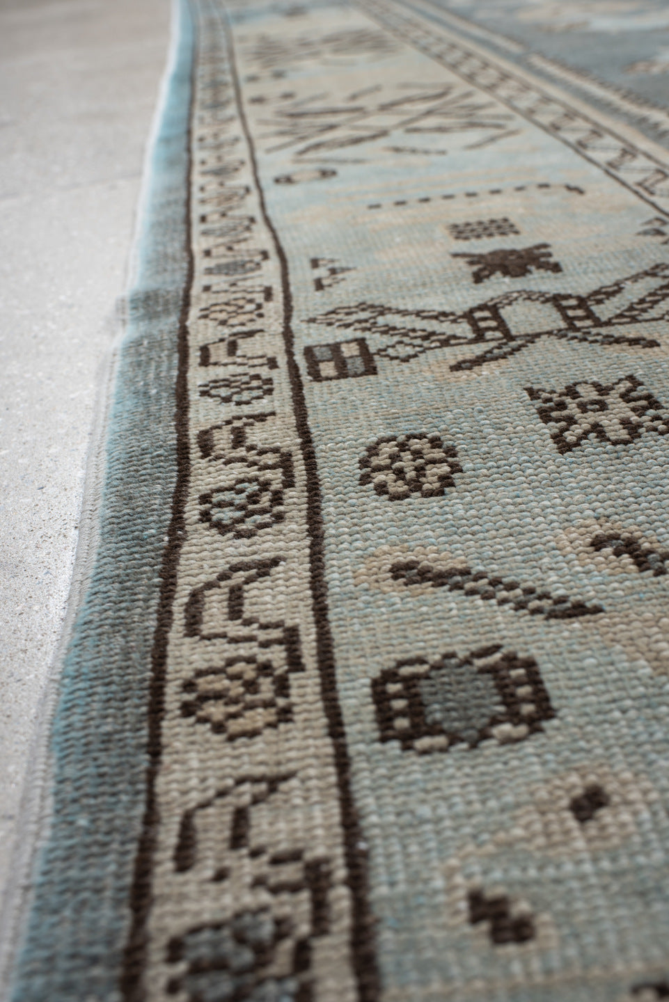 7' x 9' one-of-a-kind handmade vintage Anatolian rug. Color palette: ivory, slate, taupe, charcoal, brown, pale blue, gray