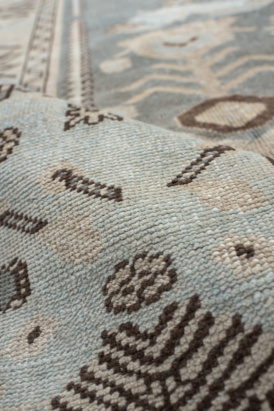 7' x 9' one-of-a-kind handmade vintage Anatolian rug. Color palette: ivory, slate, taupe, charcoal, brown, pale blue, gray