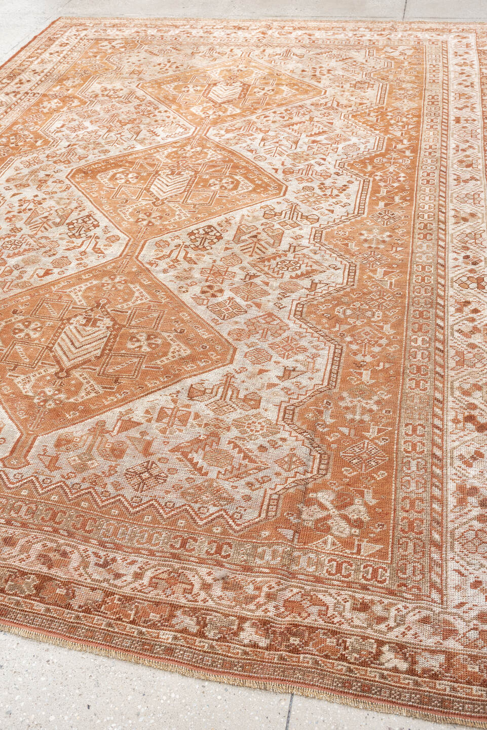 7' x 10' one-of-a-kind handmade antique Shiraz large size rug. Color palette: terra cotta, ivory, rose, rust, camel