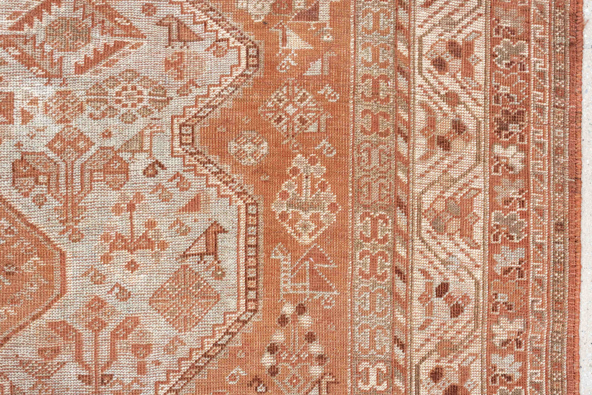 7' x 10' one-of-a-kind handmade antique Shiraz large size rug. Color palette: terra cotta, ivory, rose, rust, camel