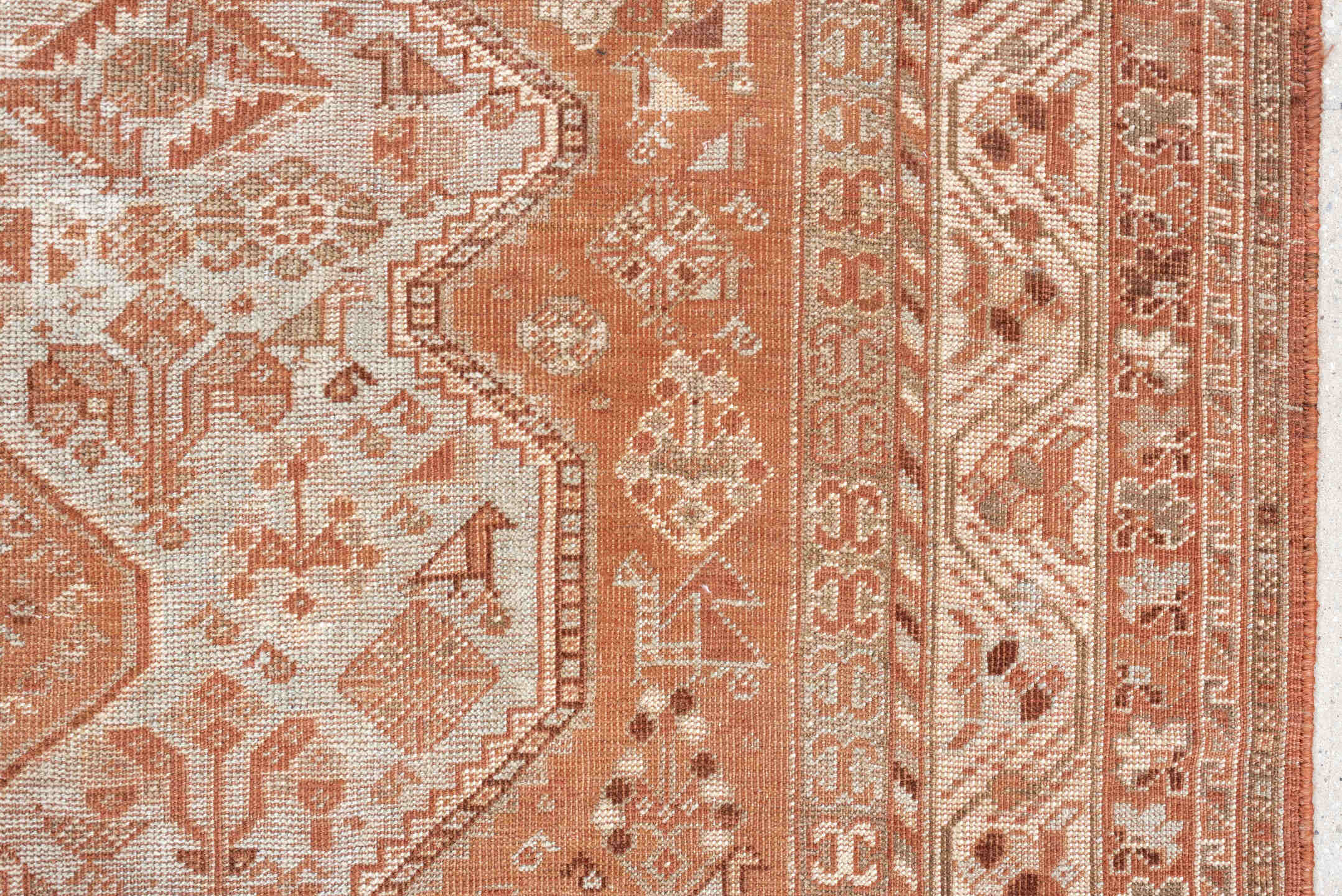 7' x 10' one-of-a-kind handmade antique Shiraz large size rug. Color palette: terra cotta, ivory, rose, rust, camel