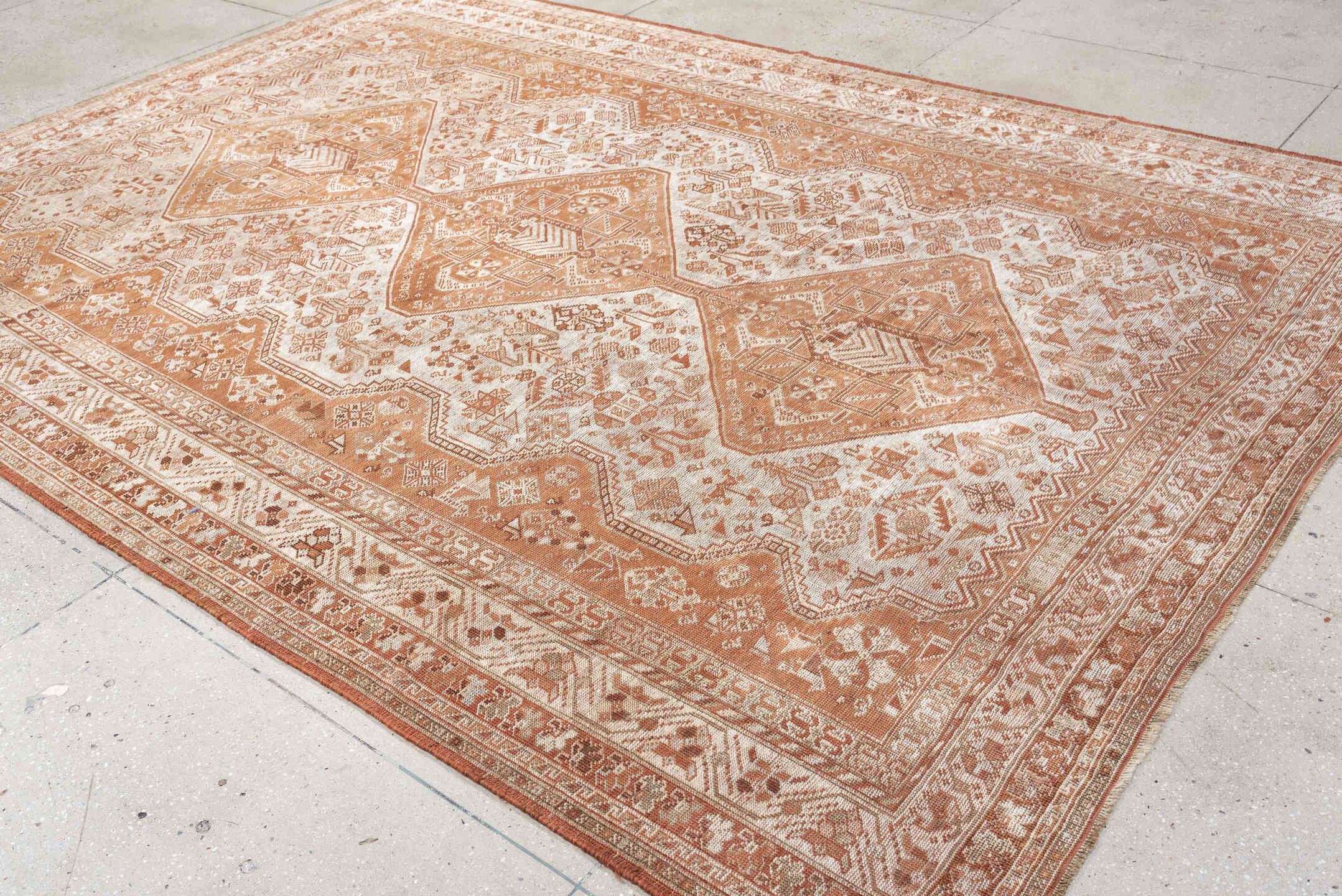 7' x 10' one-of-a-kind handmade antique Shiraz large size rug. Color palette: terra cotta, ivory, rose, rust, camel