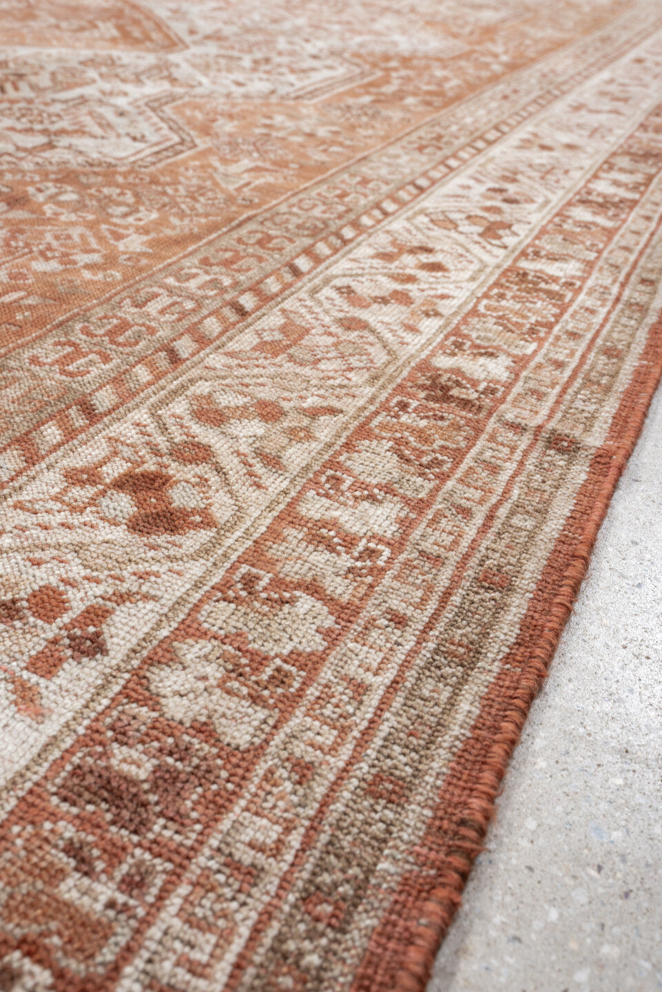 7' x 10' one-of-a-kind handmade antique Shiraz large size rug. Color palette: terra cotta, ivory, rose, rust, camel