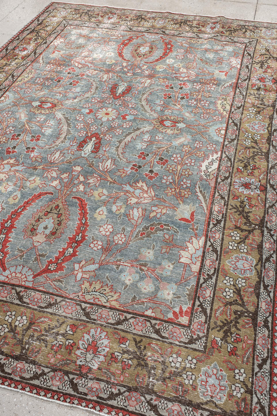 6' x 9' one-of-a-kind handmade antique Tabriz medium size rug. Color palette: light blue, camel, ivory, rust, brown, coral