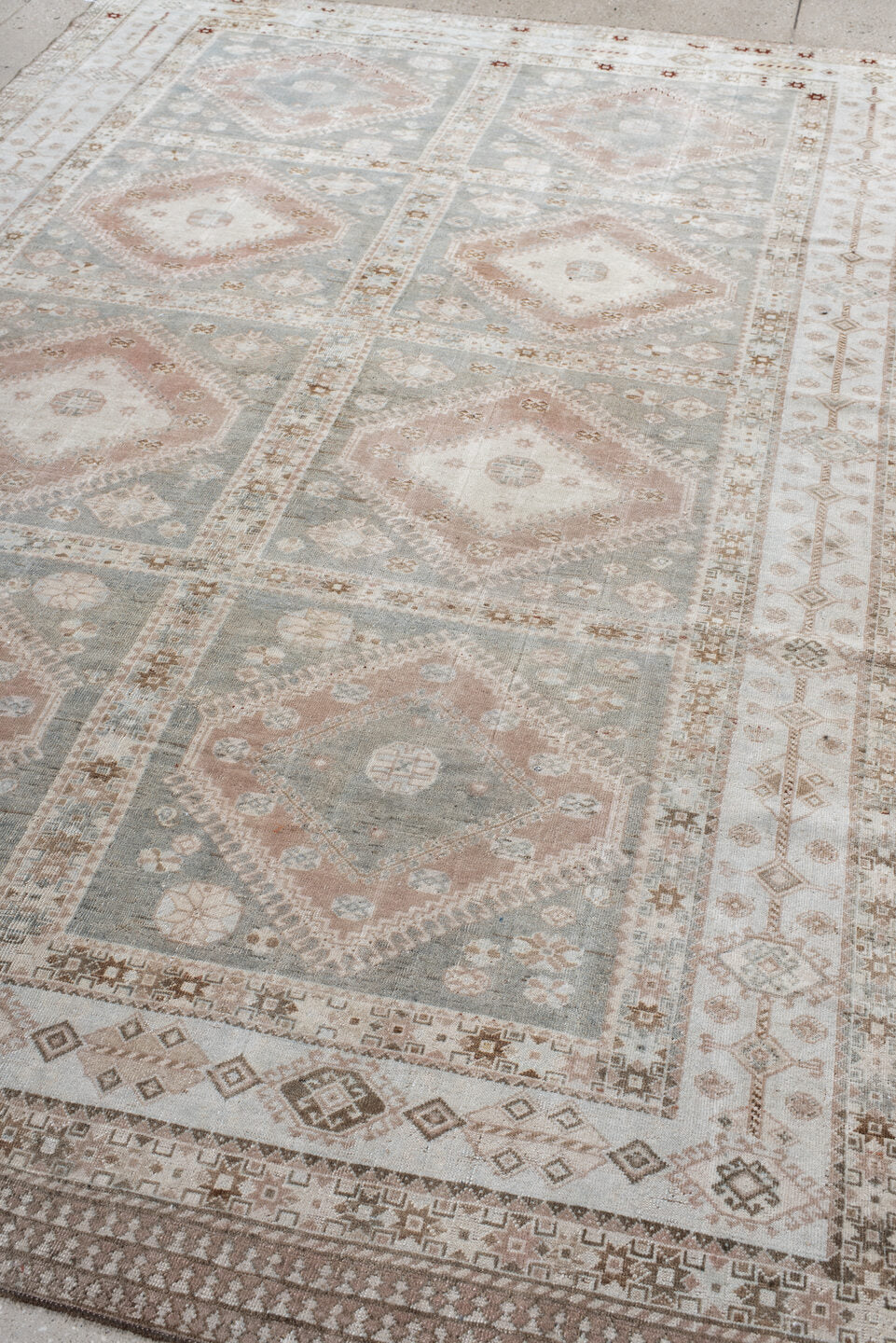 6' x 9' one-of-a-kind handmade antique Shiraz medium size rug. Color palette: ivory, blue_gray, blush, taupe, camel, rust