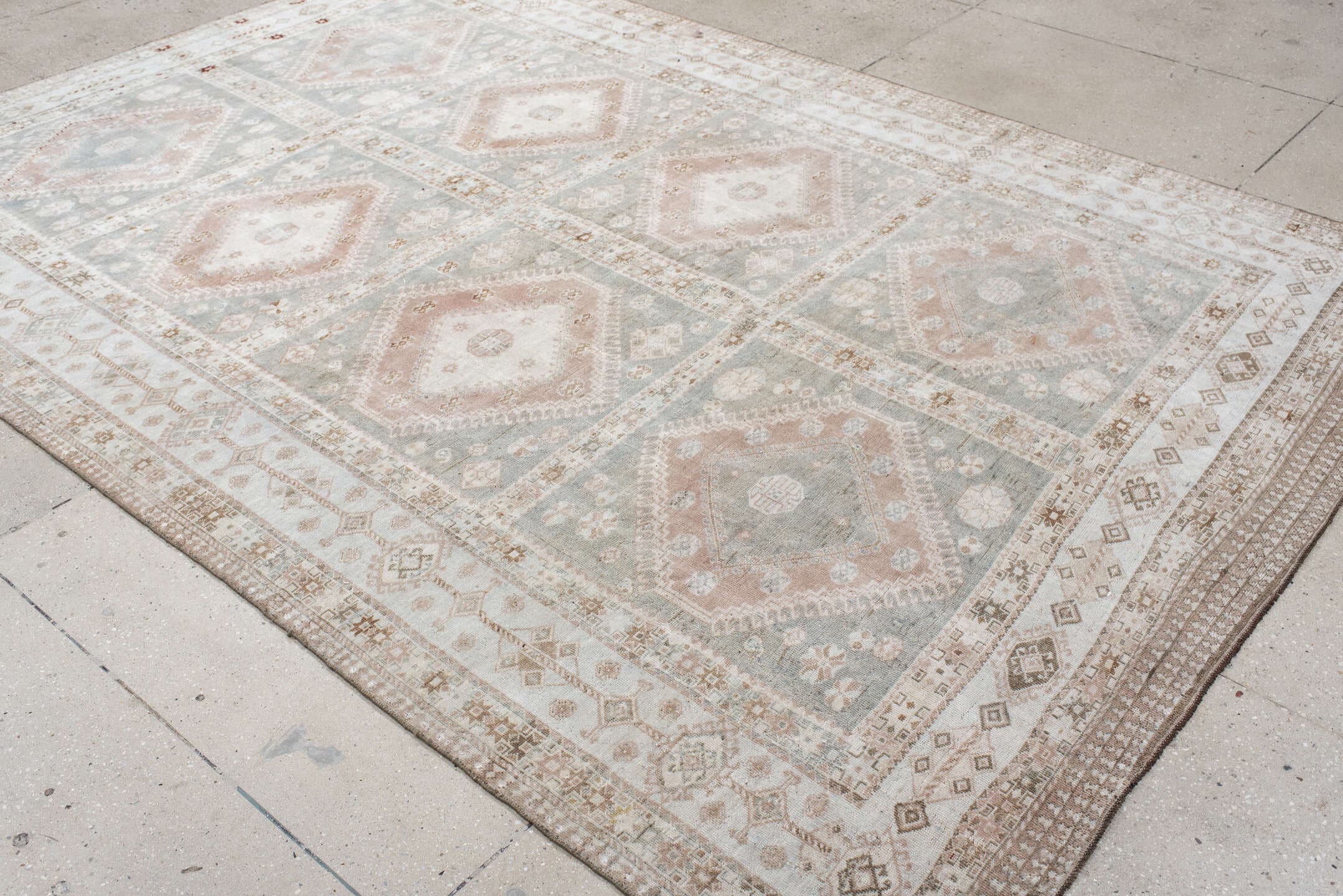 6' x 9' one-of-a-kind handmade antique Shiraz medium size rug. Color palette: ivory, blue_gray, blush, taupe, camel, rust