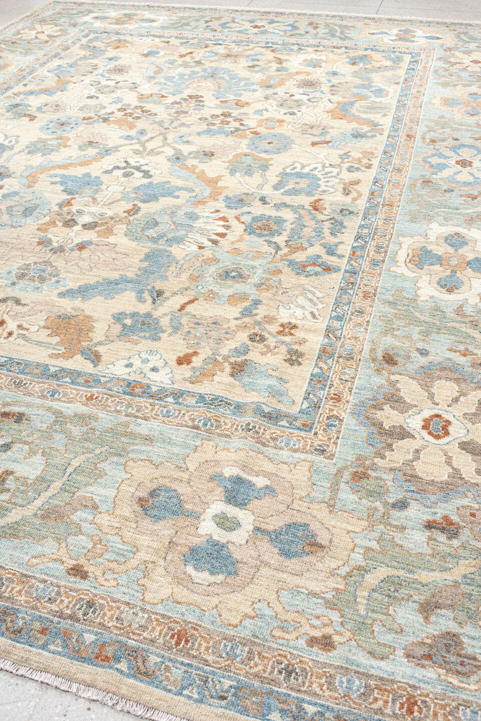 11' x 15' one-of-a-kind handmade vintage Sultanabad oversize rug. Color palette: ivory, pale blue, taupe, peach, beige, sage