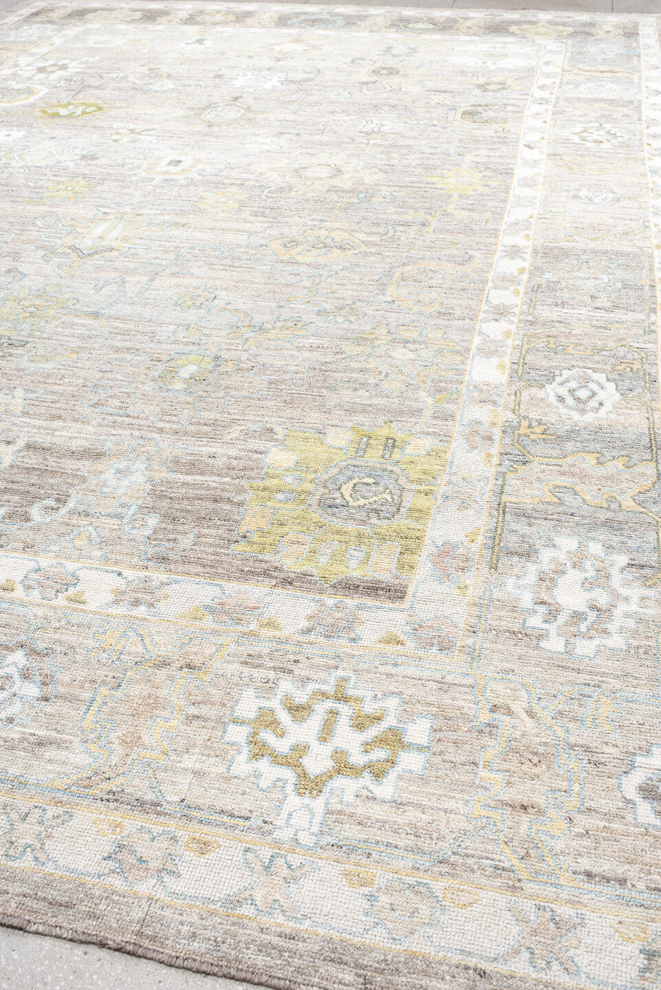 13' x 19' one-of-a-kind handmade vintage Oushak oversize rug. Color palette: taupe, ivory, light_blue, sage, gold, gray