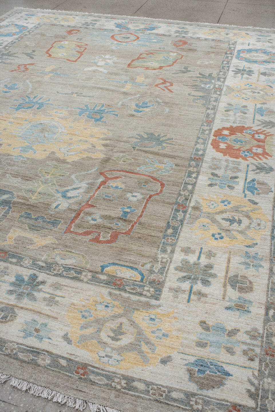 10' x 12' one-of-a-kind handmade vintage Oushak large size rug. Color palette: taupe, ivory, sky blue, sage, coral, gold