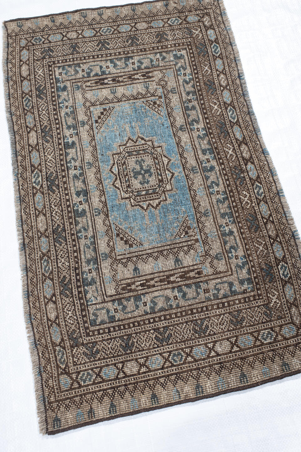 2' x 16' one-of-a-kind handmade vintage Bokara runner rug. Color palette: ivory, brown, sky blue, charcoal, taupe