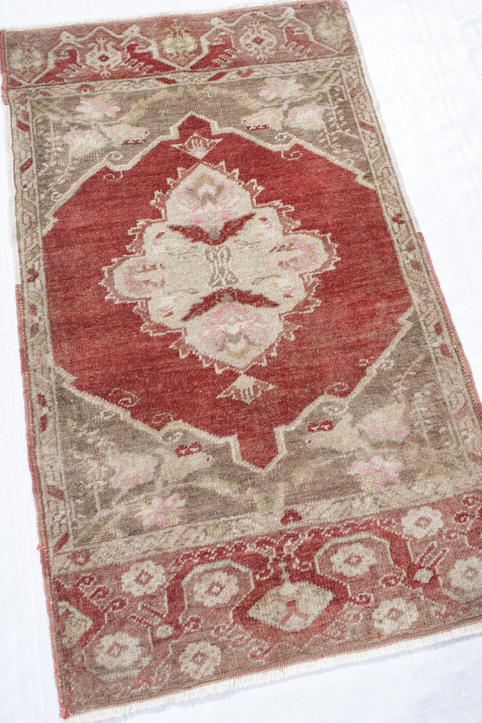 1' x 2' one-of-a-kind handmade vintage Anatolian small size rug. Color palette: terra cotta, taupe, ivory, blush, sage