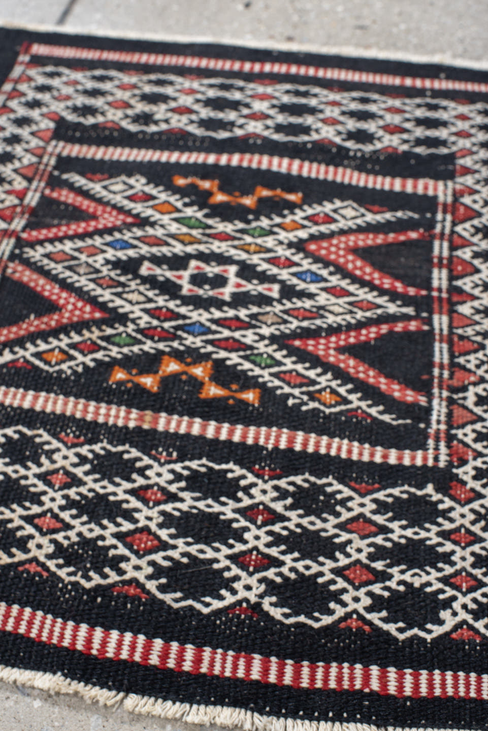 1' x 1' one-of-a-kind handmade vintage Jijim small size rug. Color palette: charcoal, ivory, rust, crimson, orange, blue